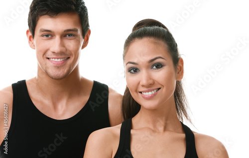 Photo: Two sportive people in black sportswear, isolated on white Two sportive people in black sportswear, isolated on white