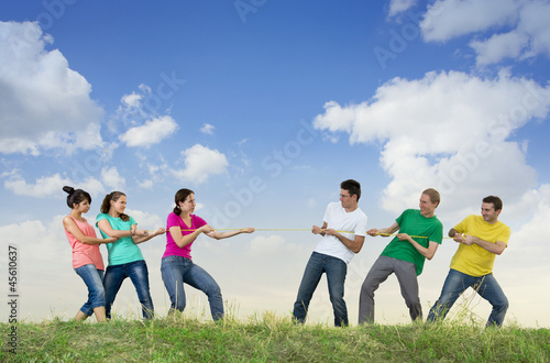 Photo: Group of young people pulling a rope Group of young people pulling a rope