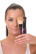 beautiful woman with a brush for powder