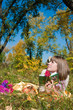 Photo: The girl reads outdoors The girl reads outdoors