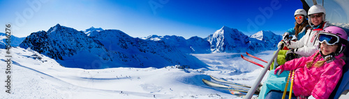Photo: Skiing - happy skiers on ski lift Skiing - happy skiers on ski lift