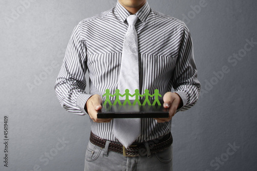 Photo: holding paper people holding paper people