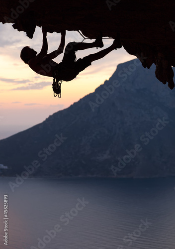  Silhouette of a rock climber at sunset. Kalymnos Island, Greece.