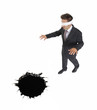 Photo: Un ejecutivo vendado,ciego acercándose a un hueco. Un ejecutivo vendado,ciego acercándose a un hueco.