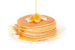 Stack pancakes with maple syrup.