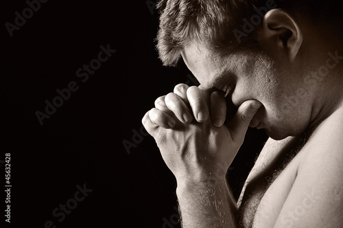 Photo: Praying man. Praying man.