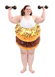Foto: Overweight woman practising with dumbbells. Weight loss concept. Overweight woman practising with dumbbells. Weight loss concept.