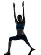 woman exercising yoga warrior position