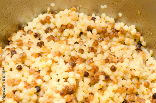 Photo: Fregola, tipica pasta sarda, closeup Fregola, tipica pasta sarda, closeup