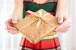 Christmas present in golden wrap