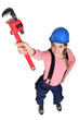 Female plulmber holding wrench