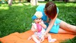Mother and her cute baby girl play outdoor