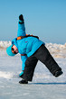 Cute little boy having fun on cold winter day