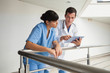 Photo: Doctor explaining some exercises to a nurse Doctor explaining some exercises to a nurse
