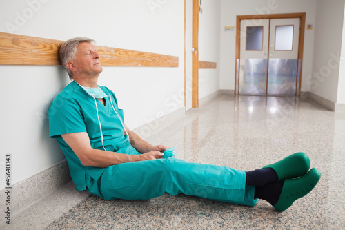 Photo: Doctor is sitting on the floor eyes closed Doctor is sitting on the floor eyes closed