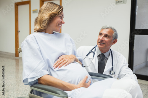 Photo: Doctor is talking to a pregnant woman Doctor is talking to a pregnant woman