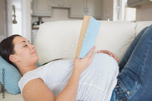 Photo: Pregnant woman with a hand on her belly Pregnant woman with a hand on her belly