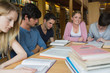 Photo: Students in the library studying together Students in the library studying together