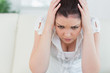 Annoyed woman sitting on the couch