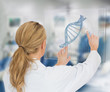 Foto: Woman using DNA helix interface Woman using DNA helix interface