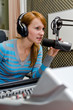 Female dj working on the radio
