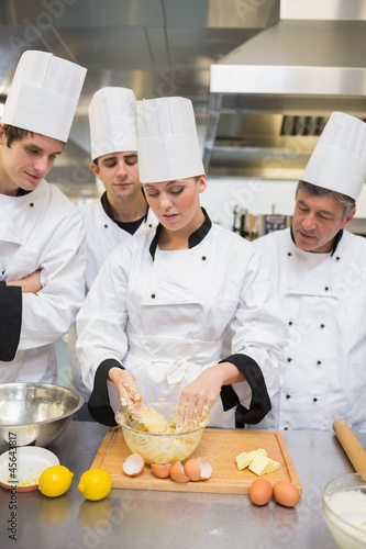 Photo: Trainees learning how to prepare dough Trainees learning how to prepare dough
