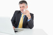 Businessman drinking coffee at his desk