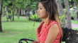 Video: Attractive Asian Girl Answers Cell Phone In The Park Attractive Asian Girl Answers Cell Phone In The Park