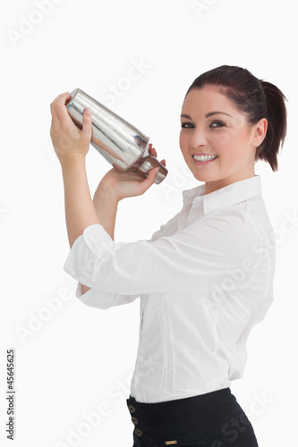 Photo: Woman shaking cocktail Woman shaking cocktail
