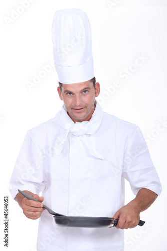 Photo: Chef stirring sauce Chef stirring sauce