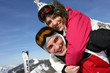 Photo: Young couple messing around on the ski slopes Young couple messing around on the ski slopes