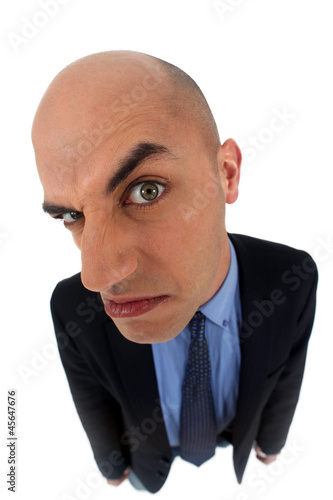 Photo: man in a suit looking very angry man in a suit looking very angry