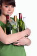 Girl recycling glass bottle