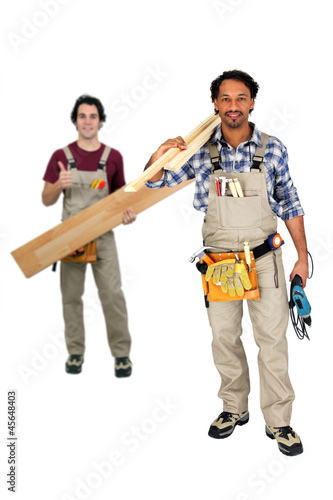 Photo: Two carpenters working together Two carpenters working together