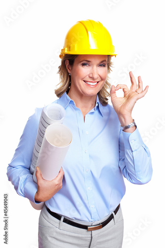 Photo: Architect woman with a plan. Architect woman with a plan.