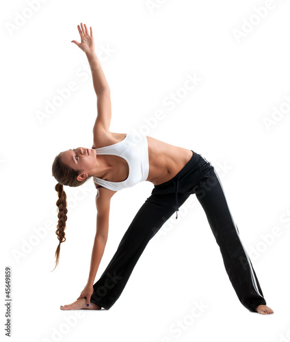 Photo: Beauty young girl posing yoga in fitness costume Beauty young girl posing yoga in fitness costume