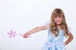 Little girl dressed as princess with wand