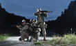 NATO soldiers in full gear. In a defensive posture.