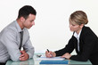Woman explaining contract to man