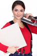 Young woman with a tile cutter