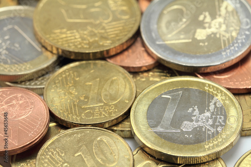 Photo: Euro coins. One Euro coin on the foreground. Shallow DOF Euro coins. One Euro coin on the foreground. Shallow DOF