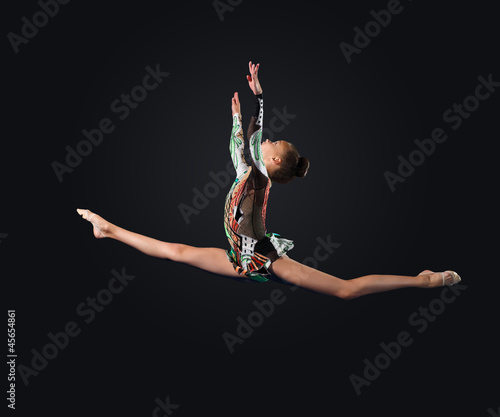 Photo: Young woman in gymnast suit posing Young woman in gymnast suit posing