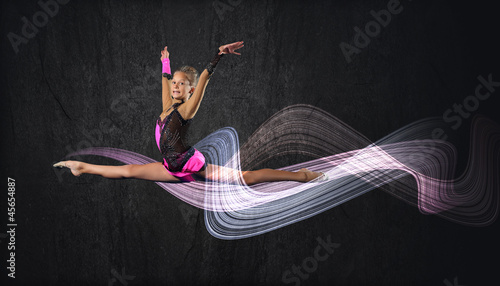 Photo: Young woman in gymnast suit posing Young woman in gymnast suit posing
