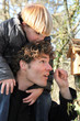 Man carrying little boy in his shoulders