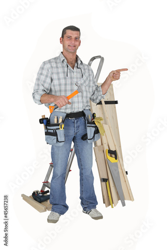 Photo: Carpenter on white background Carpenter on white background