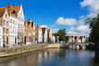 Facade of flemish houses and canal in Brugge