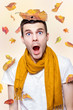 Shocked Man Playing In Falling Autumn Leaves