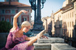 Young beautiful ballerina dancing in Bologna - Pincio, Italy. 