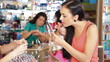 Women Shopping for Makeup Products in Beauty Department