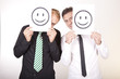 Photo: Two men with a smiley sign smiley Two men with a smiley sign smiley